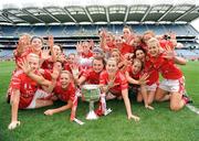 27 September 2009; The Cork team celebrate winning five titles in a row. TG4 All-Ireland Ladies Football Senior Championship Final, Cork v Dublin, Croke Park, Dublin. Picture credit: Ray McManus / SPORTSFILE