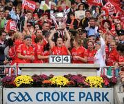 27 September 2009; Cork captain Mary O'Connor lifts the Brendan Martin cup surrounded by team-mates. TG4 All-Ireland Ladies Football Senior Championship Final, Cork v Dublin, Croke Park, Dublin. Picture credit: Stephen McCarthy / SPORTSFILE
