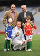 28 September 2009; Sophie Ni Cheidigh, age 7, from the Aran Islands, and Liam McCormack, age 8, from Bishopstown, Cork, with Declan Moran, Director of Marketing and Business Development, Vhi Healthcare, Dublin hurling manager Anthony Daly and Uachtarán Chumann Lúthchleas Gael Criostóir Ó Cuana, at the VHI GAA Cúl Day Out in Croke Park. 288 children from all over the country togged out today in the world-famous Croke Park stadium to attend the Vhi GAA Cúl Day Out. The 288 children were the lucky winners in the competition which was open to 82,500 children who attended a Vhi GAA Cúl Camp during the summer. Vhi GAA Cúl Day Out, Croke Park, Dublin. Picture credit: Brendan Moran / SPORTSFILE