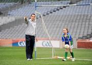 28 September 2009; Jessica Kavanagh, age 7, from Tallaght, Co. Dublin, is given a few tips by Armagh footballer Aaron Kernan at the Vhi GAA Cúl Day Out in Croke Park. 288 children from all over the country togged out today in the world-famous Croke Park stadium to attend the Vhi GAA Cúl Day Out. The 288 children were the lucky winners in the competition which was open to 82,500 children who attended a Vhi GAA Cúl Camp during the summer. Vhi GAA Cúl Day Out, Croke Park, Dublin. Picture credit: Brendan Moran / SPORTSFILE