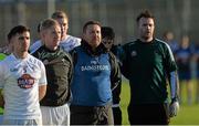 3 January 2016; Kildare manager Cian O'Neill stands with his players for the National Anthem before the game. Bord na Mona O'Byrne Cup, Group B, Kildare v DIT. St Conleth's Park, Newbridge, Co. Kildare. Picture credit: Piaras Ó Mídheach / SPORTSFILE