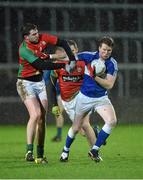 6 January 2016; Kevin Meaney, Laois, in action against Murtough Ware, Carlow. Bord na Mona O'Byrne Cup, Group C, Laois v Carlow, O'Moore Park, Portlaoise, Co. Laois. Picture credit: Matt Browne / SPORTSFILE