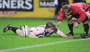 2 October 2009; Andrew Trimble, Ulster, touches down his side's second try and is conratulated by team helper, Paul Marshall. Celtic League, Ulster v Llanelli Scarlets, Ravenhill Park, Belfast, Co. Antrim. Picture credit: Oliver McVeigh / SPORTSFILE