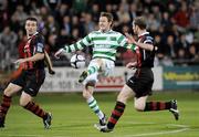 2 October 2009; Gary Twigg, Shamrock Rovers, has a shot at goal between  Bohemians defenders Brian Shelley and Owen Heary. League of Ireland Premier Division, Shamrock Rovers v Bohemians, Tallaght Stadium, Tallaght, Dublin. Picture credit: Matt Browne / SPORTSFILE