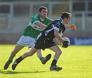 4 October 2009; Stephen McGuigan, Dungiven St Canice's, in action against Paul Young, Loup St Patrick's. Derry County Senior Football Final, Dungiven St Canice's v Loup St Patrick's, Celtic Park, Derry. Picture credit: Oliver McVeigh / SPORTSFILE