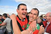 4 October 2009; Dessie Dolan, right, Garrycastle, celebrates with team selector Aidan Dunning. Westmeath County Senior Football Final, St Loman's, Mullingar v Garrycastle, Cusack Park, Mullingar, Co. Westmeath. Picture credit: David Maher / SPORTSFILE