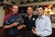 3 October 2009; Fergus McAlister, left, and Sean McKeegan, right, Cushendall GAA club, receive their runners up prizes from Johnny Davis, Pioneer Promotions. Guinness, an official sponsor of the GAA Hurling All-Ireland Senior Championship, brought hurling off the pitch and into specially built 3D Perspex cubes this weekend in Cushendall GAA Club. Cushendall was selected as the first club to host a regional Guinness Hurling Cubed Invitational Championship. The eventual winners were Loughgiel GAA Club and players Karl Casey, Barney McAuley and Damien Quinn, were crowned champions of the Cushendall Guinness Hurling Cubed Invitational Championship 2009. Guinness has donated €1000 to the winning team’s GAA club, and the Cube has also be donated to Cushendall by Guinness. The Cushendall Guinness Hurling Cubed Invitational will be followed by similar events in Dunboyne GAA Club, Meath, Carlow IT, and Ahane GAA Club in Limerick during the month of October. Cushendall GAA Club, Cushendall, Co. Antrim. Picture credit: Oliver McVeigh / SPORTSFILE