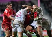 9 January 2016; Mario Sagario, Munster, is tackled by Paul Williams, left, Sergio Parisse, centre, and Waisea Vuidarvuwalu, Stade Français Paris. European Rugby Champions Cup, Pool 4, Round 2 Refixture, Stade Francais Paris v Munster, Stade Jean Bouin, Paris, France. Picture credit: Ramsey Cardy / SPORTSFILE