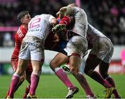 9 January 2016; Mario Sagario, Munster, is tackled by Paul Williams, left, Sergio Parisse, centre, and Waisea Vuidarvuwalu, Stade Français Paris. European Rugby Champions Cup, Pool 4, Round 2 Refixture, Stade Francais Paris v Munster, Stade Jean Bouin, Paris, France. Picture credit: Ramsey Cardy / SPORTSFILE