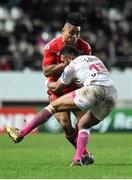 9 January 2016; Francis Saili, Munster, is tackled by Waisea Vuidarvuwalu, Stade Français Paris. European Rugby Champions Cup, Pool 4, Round 2 Refixture, Stade Francais Paris v Munster, Stade Jean Bouin, Paris, France. Picture credit: Ramsey Cardy / SPORTSFILE