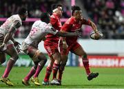 9 January 2016; Francis Saili, Munster, offloads under pressure from Paul Gabrillagues, Stade Français Paris. European Rugby Champions Cup, Pool 4, Round 2 Refixture, Stade Francais Paris v Munster, Stade Jean Bouin, Paris, France. Picture credit: Ramsey Cardy / SPORTSFILE