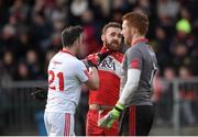 10 January 2016; Cathal McCarron, Tyrone, and Emmett McGuckin, Derry, exchange views shortly before McGuckin received a second yellow and subsequent red card and McCarron received a yellow card. Bank of Ireland Dr. McKenna Cup, Group A, Round 2, Derry v Tyrone. Derry GAA Centre of Excellence, Owenbeg, Derry. Picture credit: Stephen McCarthy / SPORTSFILE