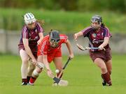 10 October 2009; Maria Walsh, Cork, in action against Jennifer Coone, left, and Caroline Kelly, Galway. Gala All-Ireland Intermediate Camogie Championship Final Replay, Cork v Galway, McDonagh Park, Nenagh, Co. Tipperary. Picture credit: Diarmuid Greene / SPORTSFILE