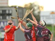 10 October 2009; Colette Gill, left, and Cathy Bowes, Galway, in action against Maria Walsh, left, and Liz Power, Cork. Gala All-Ireland Intermediate Camogie Championship Final Replay, Cork v Galway, McDonagh Park, Nenagh, Co. Tipperary. Picture credit: Diarmuid Greene / SPORTSFILE