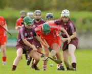 10 October 2009; Mary Coleman, Cork, in action against Colette Gill, left, and Jennifer Coone Galway. Gala All-Ireland Intermediate Camogie Championship Final Replay, Cork v Galway, McDonagh Park, Nenagh, Co. Tipperary. Picture credit: Diarmuid Greene / SPORTSFILE
