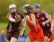 10 October 2009; Leah Weste, Cork, in action against Martina Conroy, left, and Caroline Murray, Galway. Gala All-Ireland Intermediate Camogie Championship Final Replay, Cork v Galway, McDonagh Park, Nenagh, Co. Tipperary. Picture credit: Diarmuid Greene / SPORTSFILE