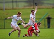 10 January 2016; Enda Lynn, Derry, in action against Peter Harte, left, and Kieran McGeary, Tyrone. Bank of Ireland Dr. McKenna Cup, Group A, Round 2, Derry v Tyrone. Derry GAA Centre of Excellence, Owenbeg, Derry. Picture credit: Stephen McCarthy / SPORTSFILE