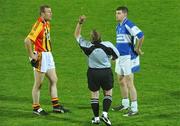 10 October 2009; Referee Micheal O Conchuir catches the coin after tossing between Tom McLoughlin, Dromcollogher Broadford, left, and Conor McCarthy, Fr.Casey's. Limerick County Senior Football Final, Dromcollogher Broadford v Fr.Casey's, Gaelic Grounds, Limerick. Picture credit: Diarmuid Greene / SPORTSFILE