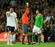10 October 2009; Republic of Ireland's Leon Best receives a yellow card from Norwegian referee Terje Hauge. 2010 FIFA World Cup Qualifier, Republic of Ireland v Italy, Croke Park, Dublin. Photo by Sportsfile