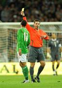 10 October 2009; Republic of Ireland's Leon Best is shown a yellow card by referee Terje Hauge. 2010 FIFA World Cup Qualifier, Republic of Ireland v Italy, Croke Park, Dublin. Picture credit: Brendan Moran / SPORTSFILE