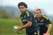 13 October 2009; Munster's Doug Howlett, supported by team-mate Keith Earls in action during squad training ahead of their Heineken Cup game against Benetton Treviso on Saturday. University of Limerick, Limerick. Picture credit: Diarmuid Greene / SPORTSFILE