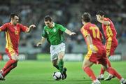 14 October 2009; Liam Miller, Republic of Ireland, in action against Nikola Drincic, Elsad Zverotic and Simon Vukcevic, Montenegro. 2010 FIFA World Cup Qualifier, Republic of Ireland v Montenegro, Croke Park, Dublin. Picture credit: David Maher / SPORTSFILE