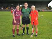 10 October 2009; Referee Karl O'Brien with Galway captain Caroline Kelly and Cork captain Ann Marie Fleming before the game. Gala All-Ireland Intermediate Camogie Championship Final Replay, Cork v Galway, McDonagh Park, Nenagh, Co. Tipperary. Picture credit: Diarmuid Greene / SPORTSFILE