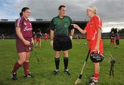 10 October 2009; Referee Karl O'Brien with Galway captain Caroline Kelly and Cork captain Ann Marie Fleming before the game. Gala All-Ireland Intermediate Camogie Championship Final Replay, Cork v Galway, McDonagh Park, Nenagh, Co. Tipperary. Picture credit: Diarmuid Greene / SPORTSFILE