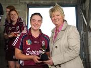 10 October 2009; Galway captain Caroline Kelly is presented with the player of the match award by Joan O'Flynn, President of the Camogie Association. Gala All-Ireland Intermediate Camogie Championship Final Replay, Cork v Galway, McDonagh Park, Nenagh, Co. Tipperary. Picture credit: Diarmuid Greene / SPORTSFILE