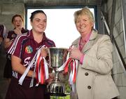 10 October 2009; Galway captain Caroline Kelly is presented with the cup by Joan O'Flynn, President of the Camogie Association. Gala All-Ireland Intermediate Camogie Championship Final Replay, Cork v Galway, McDonagh Park, Nenagh, Co. Tipperary. Picture credit: Diarmuid Greene / SPORTSFILE
