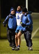 14 January 2016; Tommy Prendergast, Waterford, is helped off the pitch after picking up an injury by physio Declan Spellman, right, and selector Tony Corcoran. McGrath Cup Group B Round 2, Cork v Waterford. Mallow GAA Grounds, Mallow, Co. Cork. Picture credit: Diarmuid Greene / SPORTSFILE