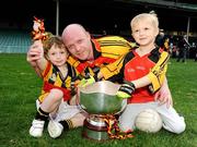 17 October 2009; Dromcollogher Broadford's Ray Lynch with his sons Robbie, aged 3, left, and Kenny, aged 5, celebrate with the cup after the game. Limerick County Senior Football Final Re-Fixture, Dromcollogher Broadford v Fr.Casey's, Gaelic Grounds, Limerick. Picture credit: Diarmuid Greene / SPORTSFILE