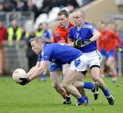 18 October 2009; Colm Donnelly, left, Fabian O'Neill, Dromore, in action against Frank McGuigan, Ardboe. Tyrone County Senior Football Final, Dromore v Ardboe, Healy Park, Omagh, Co. Tyrone. Picture credit: Michael Cullen / SPORTSFILE