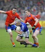 18 October 2009; Fabian O'Neill, Dromore, in action against Kyle Coney, left, Frank McGuigan, Ardboe. Tyrone County Senior Football Final, Dromore v Ardboe, Healy Park, Omagh, Co. Tyrone. Picture credit: Michael Cullen / SPORTSFILE