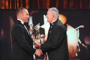 16 October 2009; PJ Ryan, of Kilkenny, is presented with his GAA Hurling All-Star award by Uachtarán CLG Criostóir Ó Cuana during the 2009 GAA All-Stars Awards, sponsored by Vodafone. Citywest Hotel, Conference, Leisure & Golf Resort, Dublin. Picture credit: Brendan Moran / SPORTSFILE