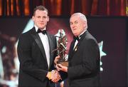 16 October 2009; Jackie Tyrrell, of Kilkenny, is presented with his GAA Hurling All-Star award by Uachtarán CLG Criostóir Ó Cuana during the 2009 GAA All-Stars Awards, sponsored by Vodafone. Citywest Hotel, Conference, Leisure & Golf Resort, Dublin. Picture credit: Brendan Moran / SPORTSFILE