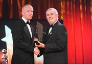 16 October 2009; John Mullane, of Waterford, is presented with his GAA Hurling All-Star award by Uachtarán CLG Criostóir Ó Cuana during the 2009 GAA All-Stars Awards, sponsored by Vodafone. Citywest Hotel, Conference, Leisure & Golf Resort, Dublin. Picture credit: Ray McManus / SPORTSFILE