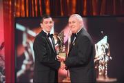 16 October 2009; Alan McCrabbe, of Dublin, is presented with his GAA Hurling All-Star award by Uachtarán CLG Criostóir Ó Cuana during the 2009 GAA All-Stars Awards, sponsored by Vodafone. Citywest Hotel, Conference, Leisure & Golf Resort, Dublin. Picture credit: Brendan Moran / SPORTSFILE