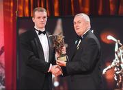 16 October 2009; Lar Corbett, of Tipperary, is presented with his GAA Hurling All-Star award by Uachtarán CLG Criostóir Ó Cuana during the 2009 GAA All-Stars Awards, sponsored by Vodafone. Citywest Hotel, Conference, Leisure & Golf Resort, Dublin. Picture credit: Brendan Moran / SPORTSFILE