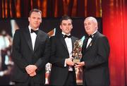 16 October 2009; Karl Lacey, of Donegal, is presented with his GAA Football All-Star award by Uachtarán CLG Criostóir Ó Cuana and Charles Butterworth, CEO Vodafone Ireland, during the 2009 GAA All-Stars Awards, sponsored by Vodafone. Citywest Hotel, Conference, Leisure & Golf Resort, Dublin. Picture credit: Brendan Moran / SPORTSFILE
