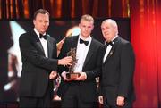 16 October 2009; Michael Shields, of Cork, is presented with his GAA Football All-Star award by Uachtarán CLG Criostóir Ó Cuana and Charles Butterworth, CEO Vodafone Ireland, during the 2009 GAA All-Stars Awards, sponsored by Vodafone. Citywest Hotel, Conference, Leisure & Golf Resort, Dublin. Picture credit: Brendan Moran / SPORTSFILE