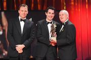 16 October 2009; Tom O'Sullivan, of Kerry, is presented with his GAA Football All-Star award by Uachtarán CLG Criostóir Ó Cuana and Charles Butterworth, CEO Vodafone Ireland, during the 2009 GAA All-Stars Awards, sponsored by Vodafone. Citywest Hotel, Conference, Leisure & Golf Resort, Dublin. Picture credit: Brendan Moran / SPORTSFILE