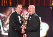 16 October 2009; Michael Walsh, of Waterford, is presented with his GAA Hurling All-Star award by Uachtarán CLG Criostóir Ó Cuana during the 2009 GAA All-Stars Awards, sponsored by Vodafone. Citywest Hotel, Conference, Leisure & Golf Resort, Dublin. Picture credit: Brendan Moran / SPORTSFILE