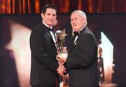 16 October 2009; Conor O'Mahony, of Tipperary, is presented with his GAA Hurling All-Star award by Uachtarán CLG Criostóir Ó Cuana during the 2009 GAA All-Stars Awards, sponsored by Vodafone. Citywest Hotel, Conference, Leisure & Golf Resort, Dublin. Picture credit: Brendan Moran / SPORTSFILE