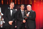 16 October 2009; Paul Galvin, of Kerry, is presented with his GAA Football All-Star award by Uachtarán CLG Criostóir Ó Cuana and Charles Butterworth, CEO Vodafone Ireland, during the 2009 GAA All-Stars Awards, sponsored by Vodafone. Citywest Hotel, Conference, Leisure & Golf Resort, Dublin. Picture credit: Brendan Moran / SPORTSFILE