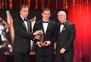 16 October 2009; Daniel Goulding, of Cork, is presented with his GAA Football All-Star award by Uachtarán CLG Criostóir Ó Cuana and Charles Butterworth, CEO Vodafone Ireland, during the 2009 GAA All-Stars Awards, sponsored by Vodafone. Citywest Hotel, Conference, Leisure & Golf Resort, Dublin. Picture credit: Brendan Moran / SPORTSFILE