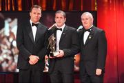 16 October 2009; Stephen O'Neill, of Tyrone, is presented with his GAA Football All-Star award by Uachtarán CLG Criostóir Ó Cuana and Charles Butterworth, CEO Vodafone Ireland, during the 2009 GAA All-Stars Awards, sponsored by Vodafone. Citywest Hotel, Conference, Leisure & Golf Resort, Dublin. Picture credit: Brendan Moran / SPORTSFILE