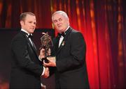 16 October 2009; Tommy Walsh, of Kilkenny, is presented with his GAA Hurling All-Star award by Uachtarán CLG Criostóir Ó Cuana during the 2009 GAA All-Stars Awards, sponsored by Vodafone. Citywest Hotel, Conference, Leisure & Golf Resort, Dublin. Picture credit: Ray McManus / SPORTSFILE