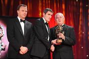 16 October 2009; Graham Canty, of Cork, is presented with his GAA Football All-Star award by Uachtarán CLG Criostóir Ó Cuana and Charles Butterworth, CEO Vodafone Ireland, during the 2009 GAA All-Stars Awards, sponsored by Vodafone. Citywest Hotel, Conference, Leisure & Golf Resort, Dublin. Picture credit: Ray McManus / SPORTSFILE