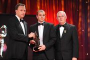 16 October 2009; John Miskella, of Cork, is presented with his GAA Football All-Star award by Uachtarán CLG Criostóir Ó Cuana and Charles Butterworth, CEO Vodafone Ireland, during the 2009 GAA All-Stars Awards, sponsored by Vodafone. Citywest Hotel, Conference, Leisure & Golf Resort, Dublin. Picture credit: Ray McManus / SPORTSFILE